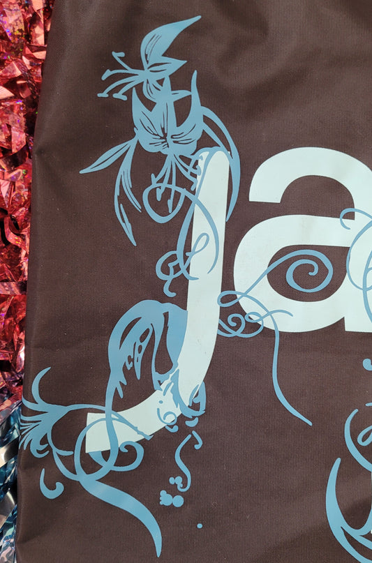 Close u[p of the floral decoration surrounding the letter 'J'