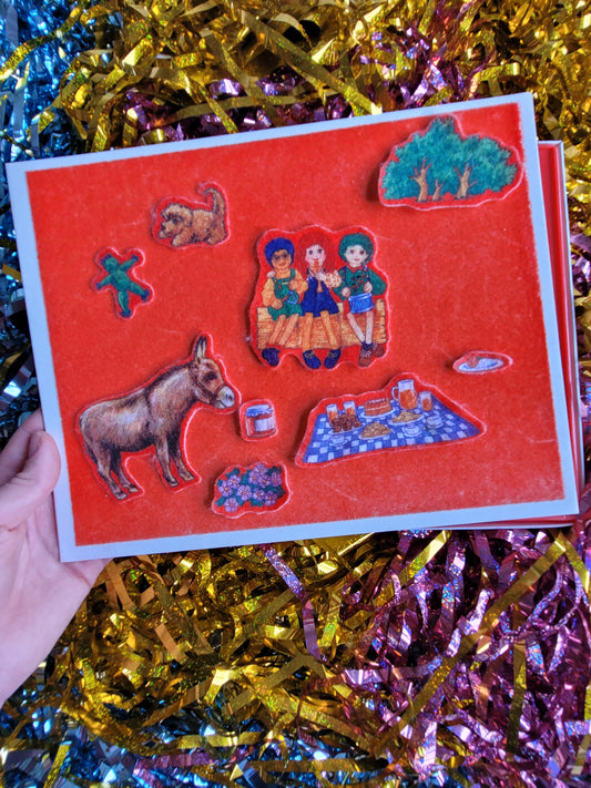 Fuzzy felt pieces placed on the red board