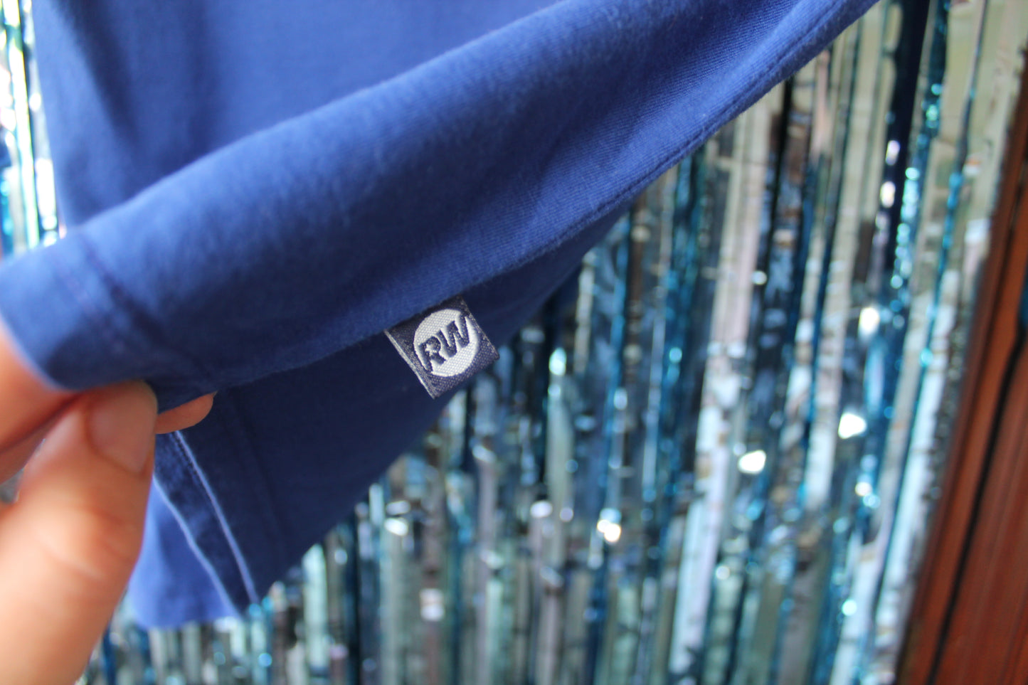 Label attached to the shirt with the official RW logo