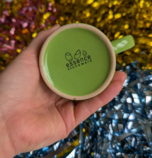 Bottom of the mug reads 'essence stoneware'
