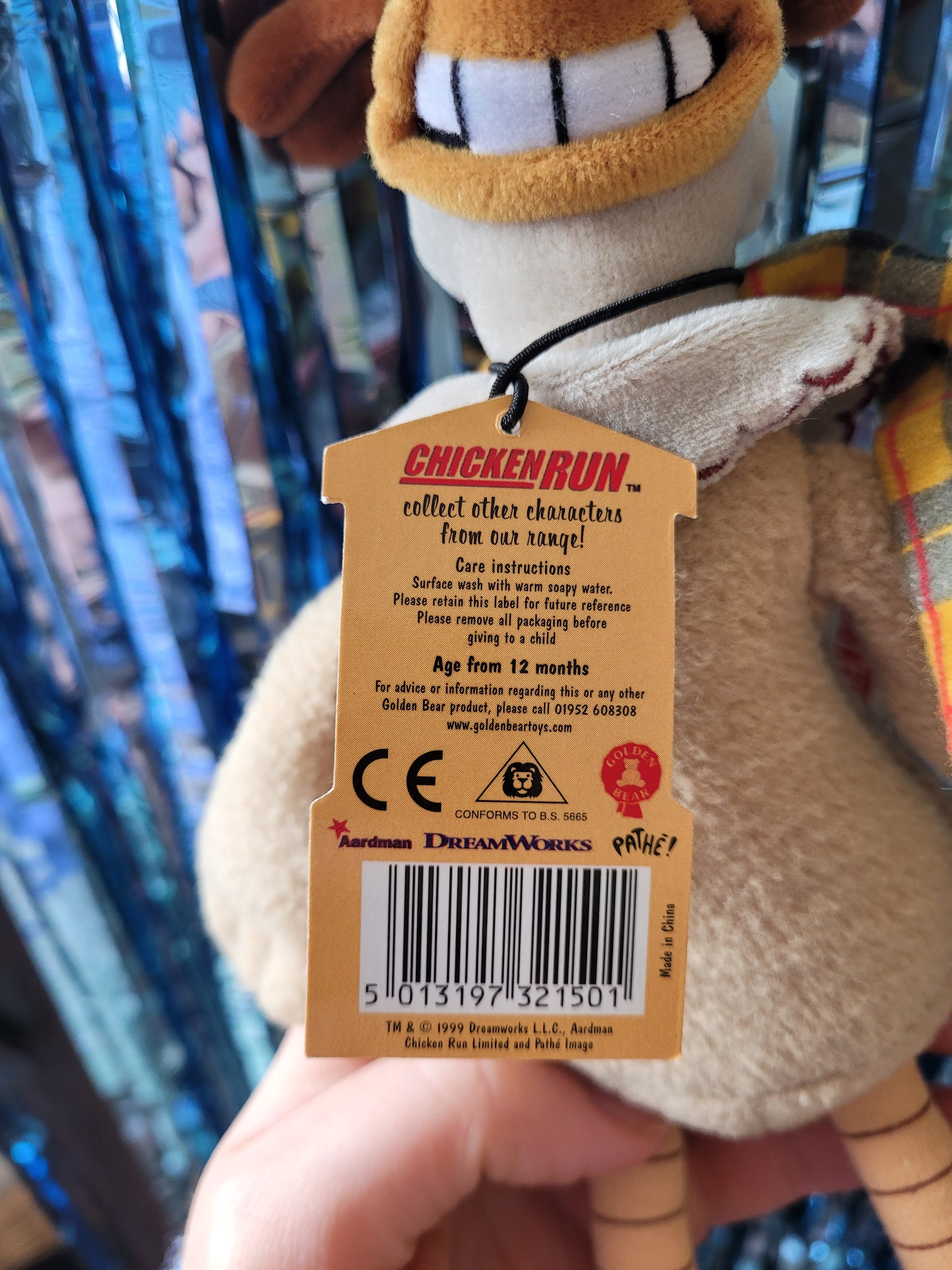Detail of the back of the tag
"Chicken Run collect other characters from our range! Care instructions surface wash with warm soapy water. Please retain this label for future reference. Please remove all packaging before giving to a child. Age from 12 months. Aardman. Dreamworks. Pathé. TM copyright 1999 Dreamworks LLC Aardman Chicken Run Ltd. Made in China"

Disclaimer: Information on the label is from 1999. Toy is not suitable for children. 