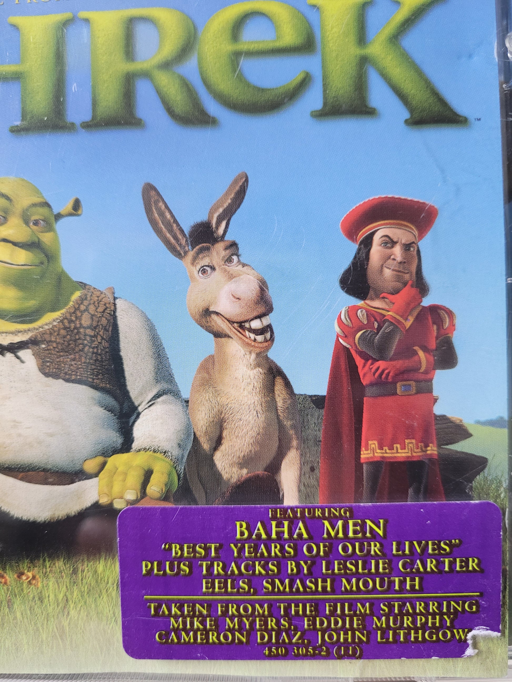 Close up of a purple sticker on the CD case which is slightly torn 