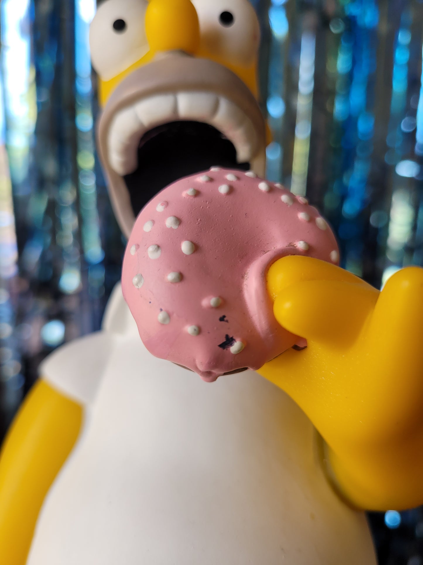 Close up of donut showing small black marks 