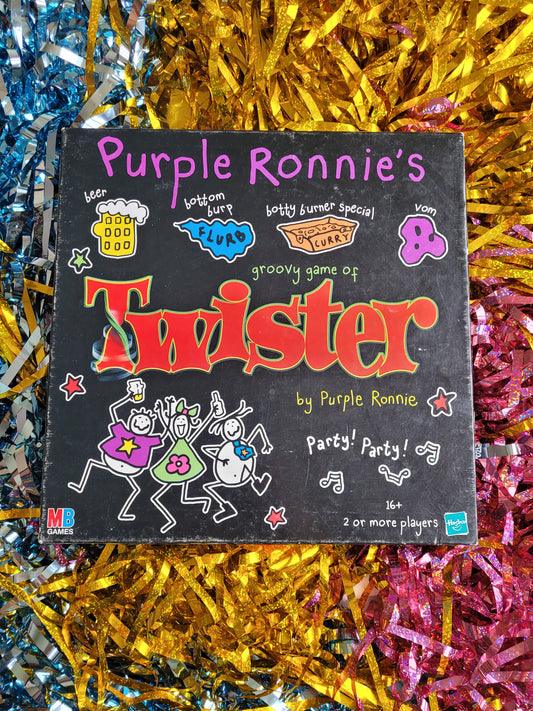 Front of Purple Ronnie twister box. With purple Ronnie characters drinking dancing in colourful clothes 
