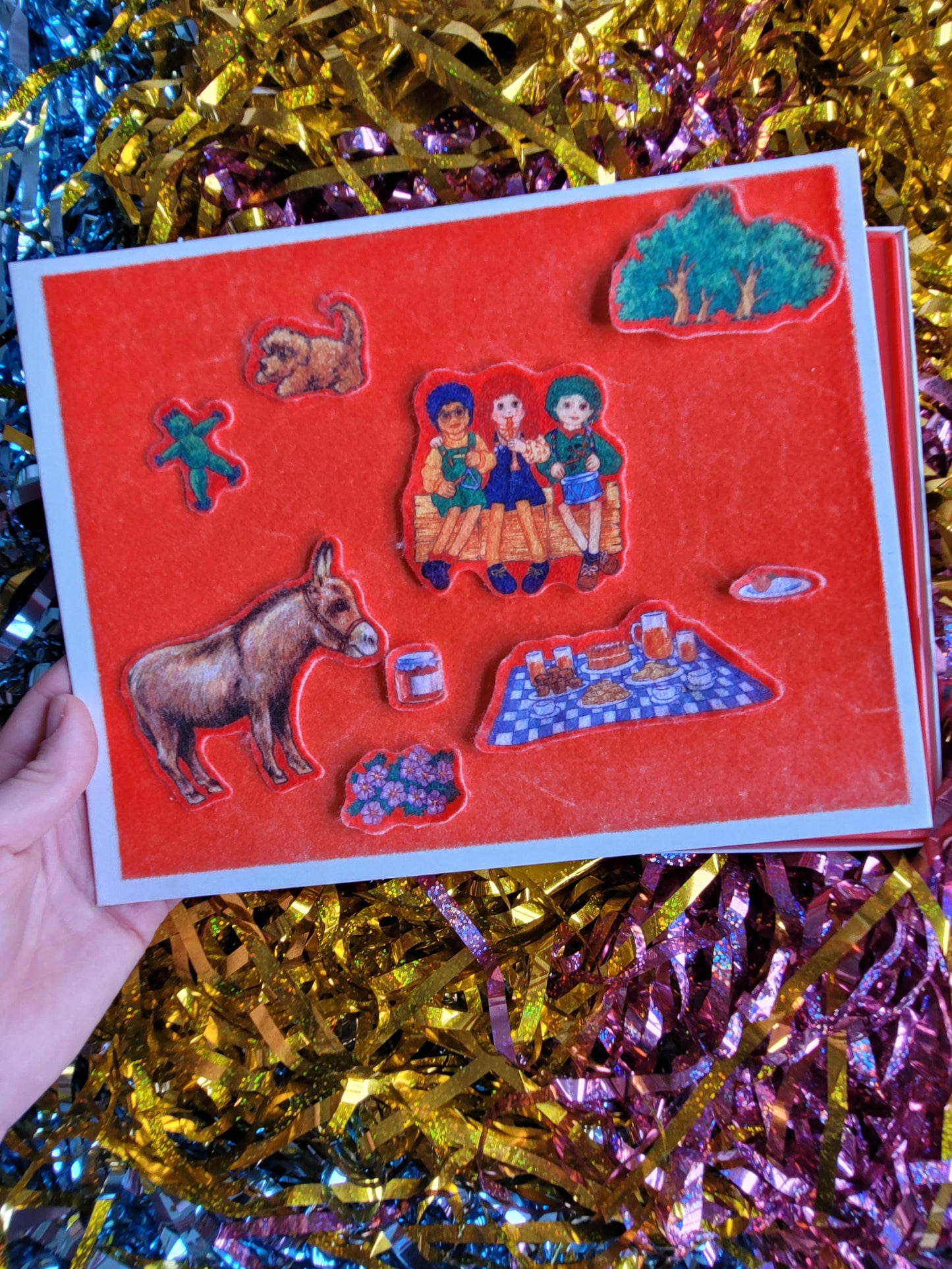 Fuzzy felt pieces placed on the red board 