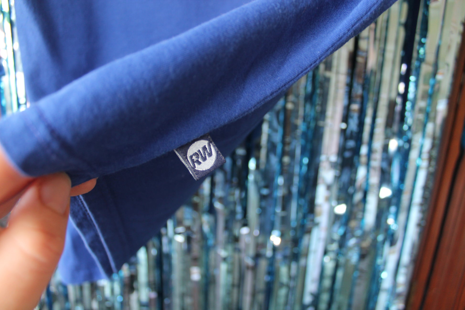 Label attached to the shirt with the official RW logo