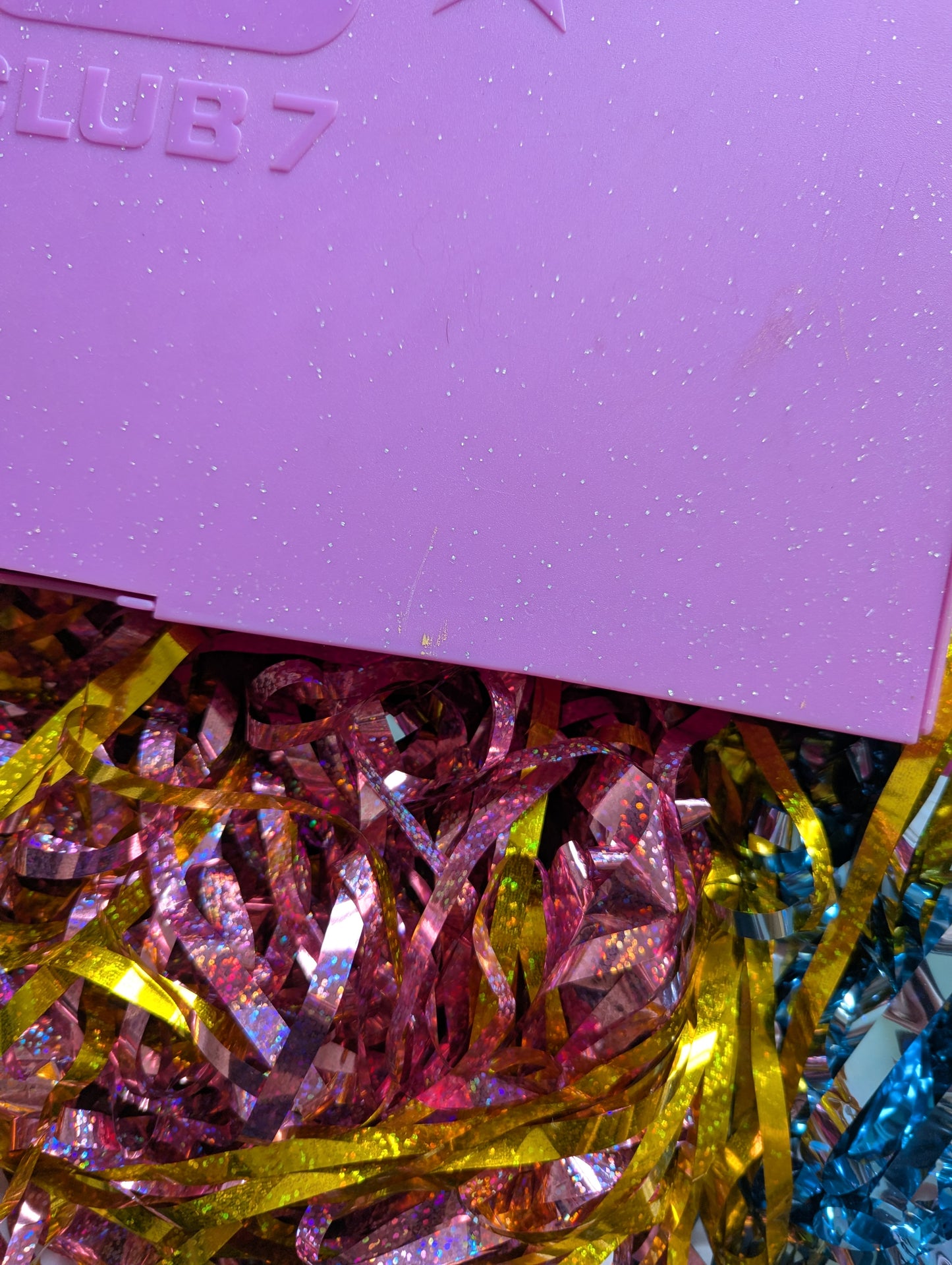 Close up of small scratches on top of box