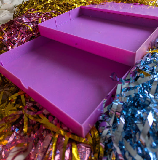 Pink box with top lid opened and bottom drawer pulled out 