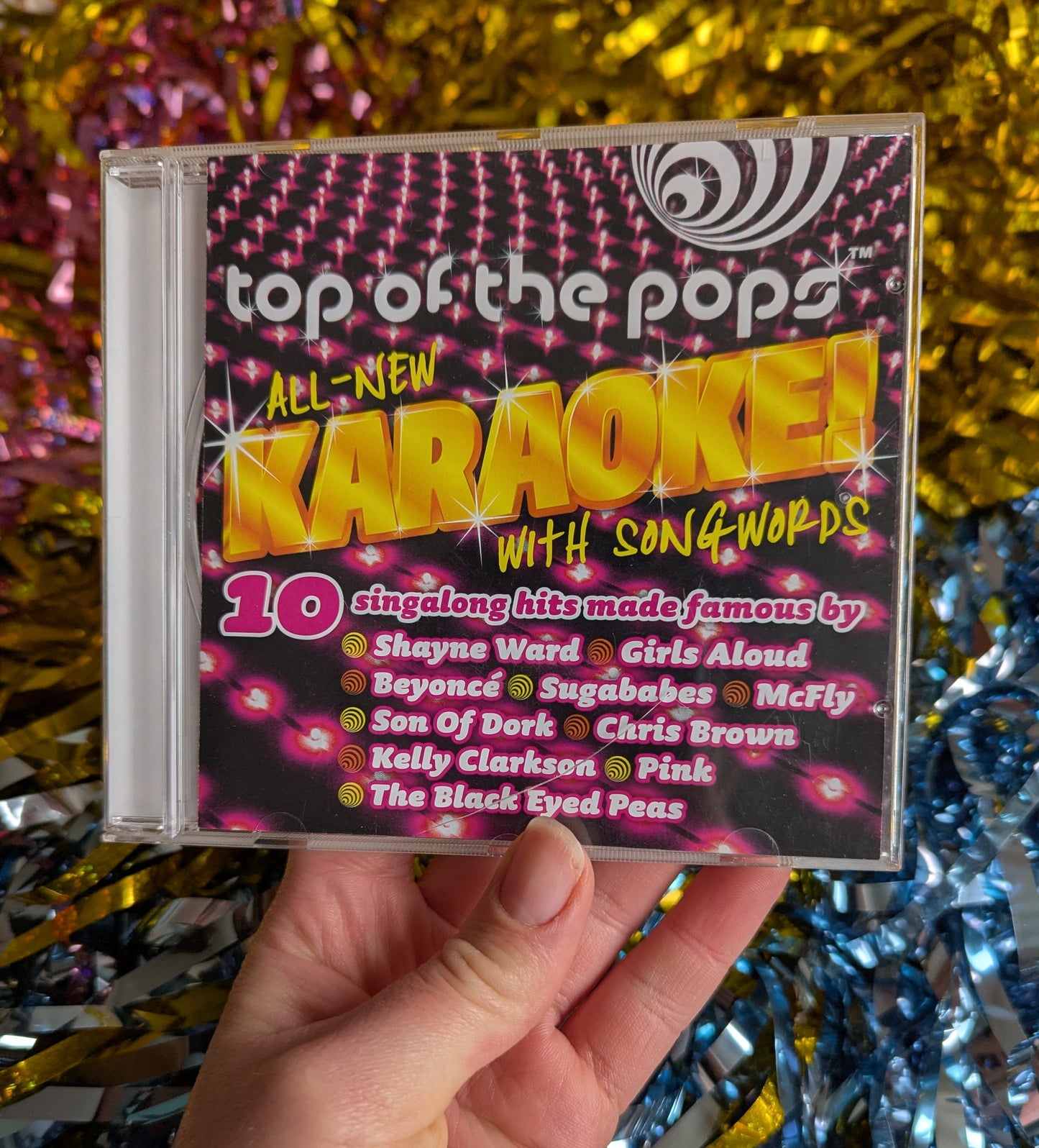 Pink and black CD case reading 'top of the Pops. all new karaoke with song words'