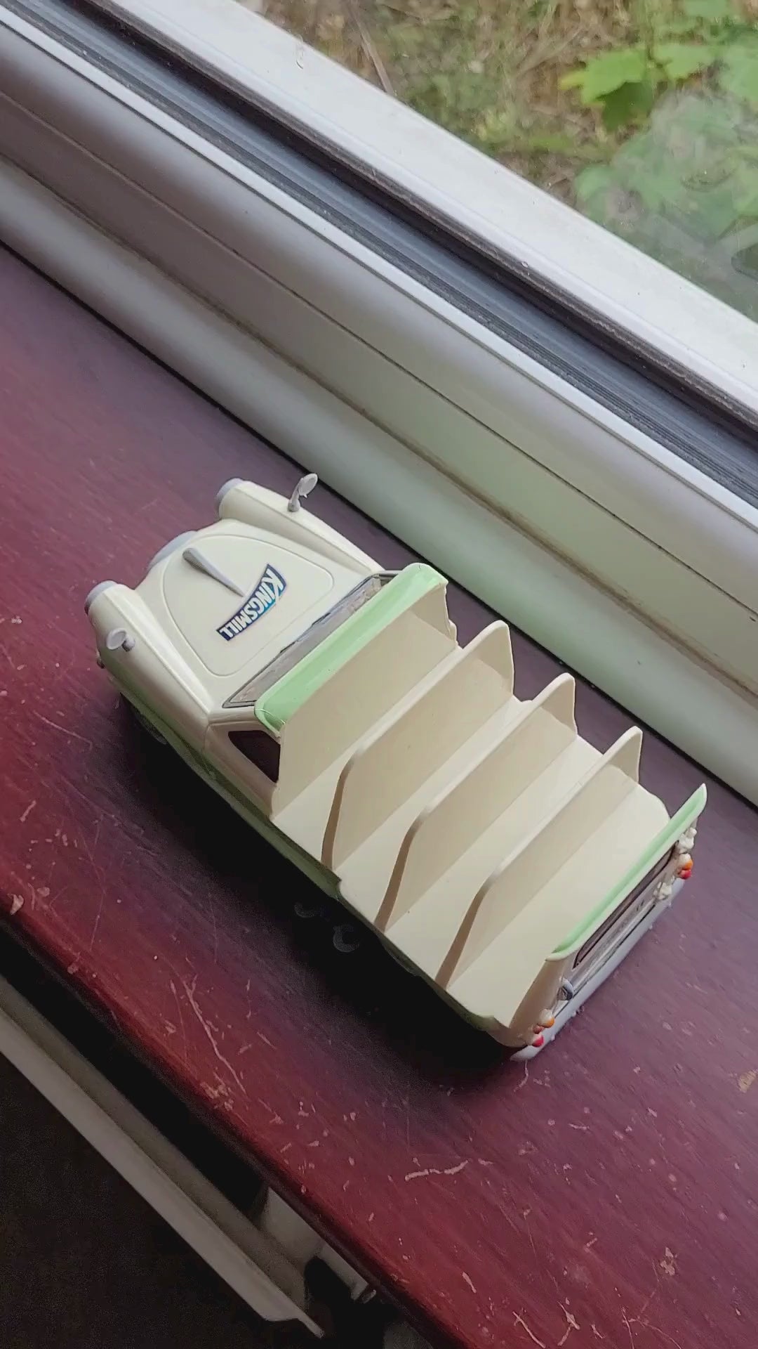 van rolls across a windowsill with a bit of a nudge 